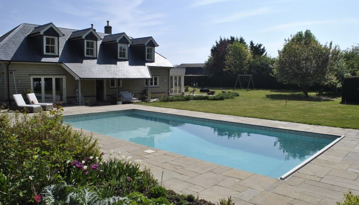Family swimming pool in a mature rural garden